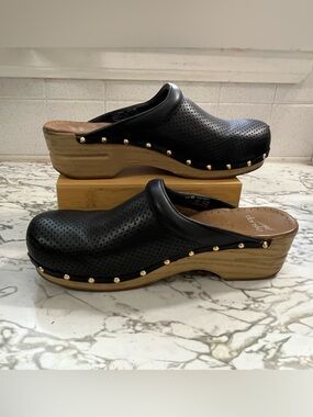 Dansko Perfed Pro Black Perforated Leather Clogs with Wood-Effect Platform.